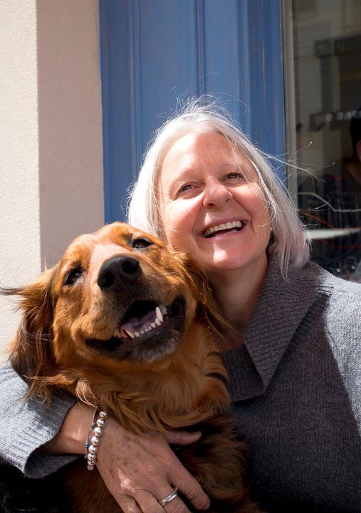 Gillaan Yates smiling outdoors with her dog Lola